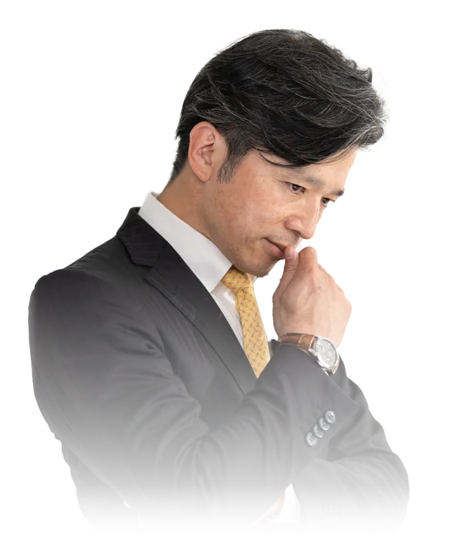 悩んでいるビジネスマン